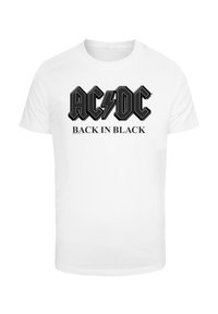 White cotton t-shirt featuring black AC/DC text logo with lightning bolt and "BACK IN BLACK" slogan in bold, contrasting typography.