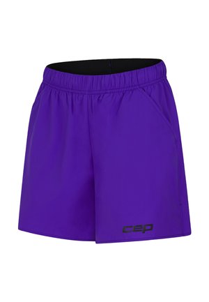 Purple athletic shorts with an elastic waistband, side pockets, and a black logo accent on the lower left. Lightweight fabric, smooth texture.