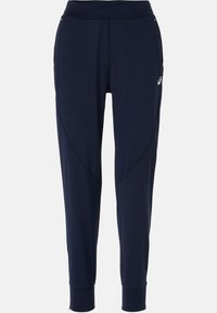 Marineblauwe sportbroek met een aansluitende tailleband, taps toelopende benen en zijnaadpanelen; gemaakt van flexibel, ademend materiaal.