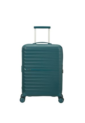 Valigia rigida color verde acqua con scanalature orizzontali, manico estensibile, quattro ruote girevoli e cerniera con chiusura laterale.