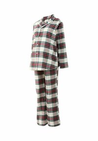 Plaid pajama set in cream, red, and green. Features button-down top and matching pants. Soft fabric with a relaxed fit.