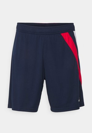 Marineblå treningsshorts med elastisk midjebånd, med røde og hvite sidelapper, glatt tekstur og knelengde.