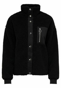 Musta fleece-takki, jossa on korkea kaulus, nepparipainikkeet ja vetoketjullinen rintatasku, jossa on hopeinen rengasviimeistely. Pehmeä, teksturoitu materiaali.