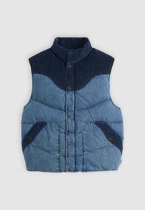 Vest din denim albastru cu guler înalt, textură căptușită și accente din corduroy bleumarin. Dispune de două buzunare frontale și închideri cu nasturi.