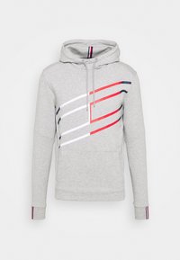 Felpa grigia con tasca a scomparsa sul davanti, caratterizzata da strisce diagonali rosse, bianche e blu navy sul petto. Cappuccio con cordino e polsini a coste.