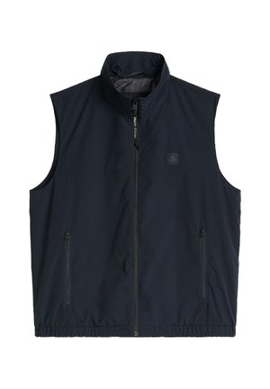 Ärmellose marineblaue Weste mit Frontreißverschluss, zwei Reißverschlusstaschen, hohem Kragen und kleinem "M OP" Logo auf der Brust.