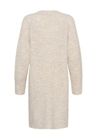 Pletena bež haljina s opuštenim krojem, dugim rukavima i mekanim, teksturiranim završetkom. Okrugli dekolte i haljina srednje dužine.
