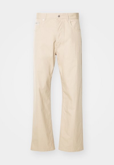Beige trousers made of cotton, featuring a straight leg design, two front pockets, belt loops, and a metal button closure.