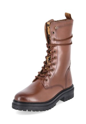 Brauner Leder-Schnürkampfstiefel mit schwarzer Profilsohle und leopardgemustertem Stofffutter sichtbar an der Zunge.