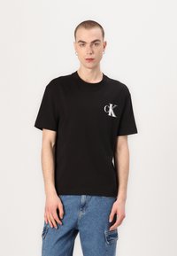 Calvin Klein Jeans - BOLD TEE UNISEX - T-shirts print - black Miniaturebillede 1