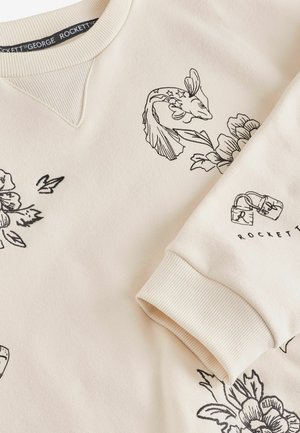 Hellbeige Sweatshirt aus weichem Stoff mit schwarzen floralem und fischförmigem Illustrationen. Rippkragen und Rippbündchen verbessern die Struktur und Passform.