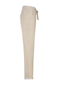 Beige bukser med et tilspidset design, elastisk talje, snørelukning, sidelommer og opkørte kanter. Blød tekstur med diskrete linjer.