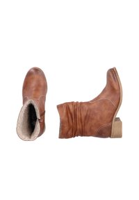 Braune Leder-Stiefeletten mit einem lässigen Design, feinen Nähdetails, einem strukturierten Fellfutter und einem kleinen Blockabsatz.