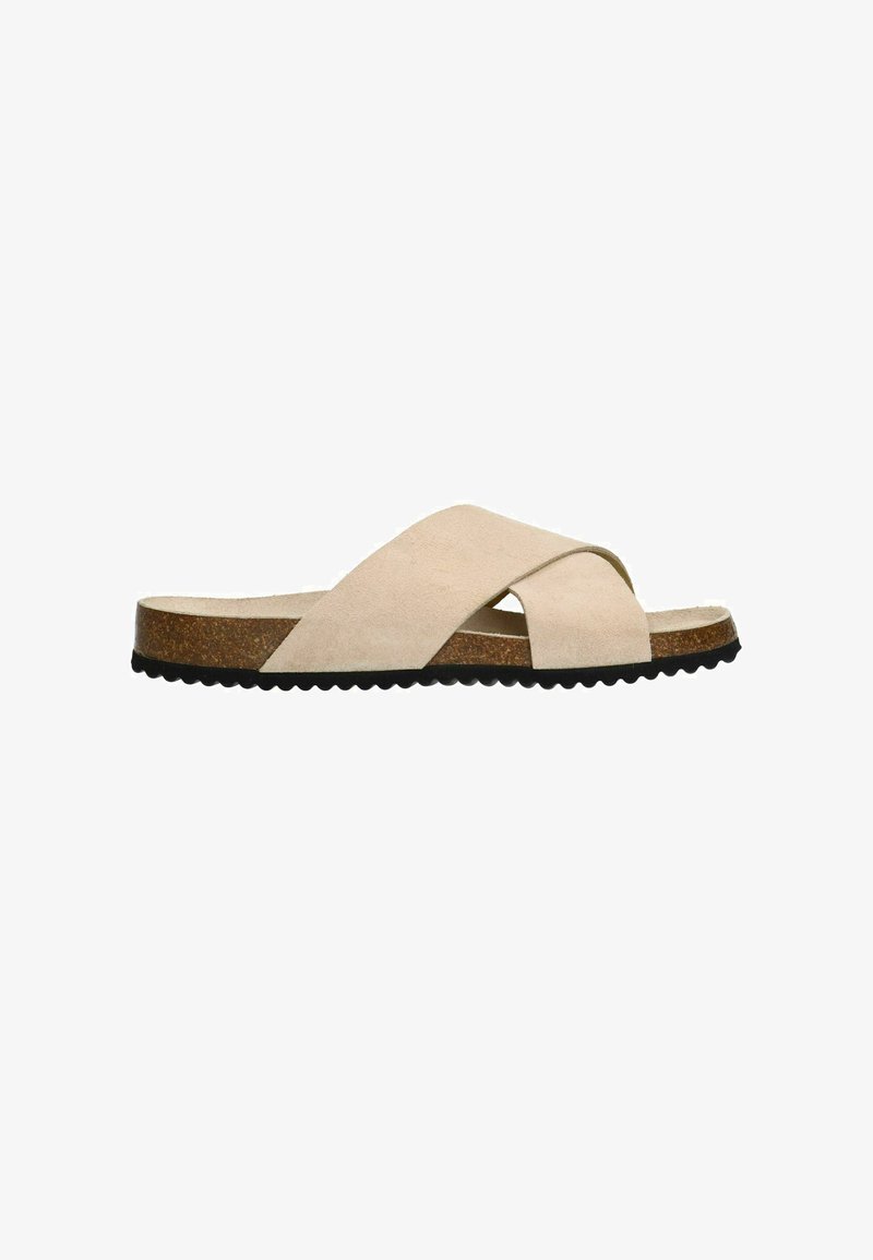 Beige suède cross-strap slidesandalen met een kurken voetbed en een zwart gegolfde rubberen zool. Minimalistisch ontwerp met een gladde textuur.