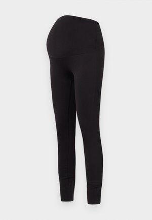 Leggings de maternidad negros con una tela elástica y suave. El diseño incluye una cintura alta para acomodar una barriga en crecimiento. La longitud llega hasta los tobillos.