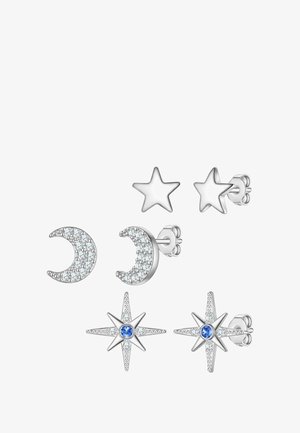 Komplet treh uhanskih dodatkov: en polmesec s prozornimi kamni, ena gladka zvezda in ena zvezda z modrim osrednjim kamnom, vse v srebrni barvi.