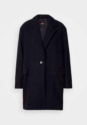 Casaco preto de lã com colarinho em notched, fecho de botão único, duas bolsos frontais e forro acolchoado. Design simples e elegante.