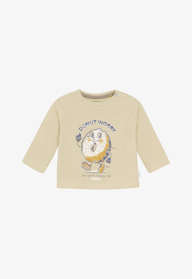 Langarm, beige katoenen shirt met een cartoon-donut met een lach, "DOENUT WORRY" tekst en blauwe accenten. Drukknopen bij de schouder.