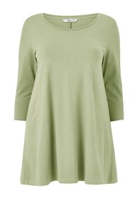 Tunique à manches longues de couleur vert clair, avec un col rond et une coupe décontractée, fabriquée en tissu doux et respirant ; texture lisse, design simple.