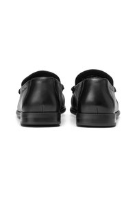 Black leather shoes with a smooth finish, rounded shape, and a low heel. The design features an open back and subtle stitching details.