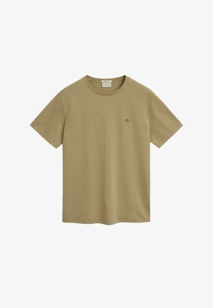 T-shirt en coton vert olive avec un col rond et des manches courtes. Présente un petit logo brodé sur la partie gauche de la poitrine.