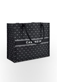 Large black tote bag made of durable fabric with a diamond pattern and white logo. Features dual black handles and a structured shape.