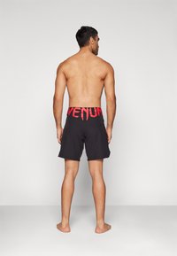 Venum RAPID FIGHTSHORTS - Sport rövidnadrágok - black/red