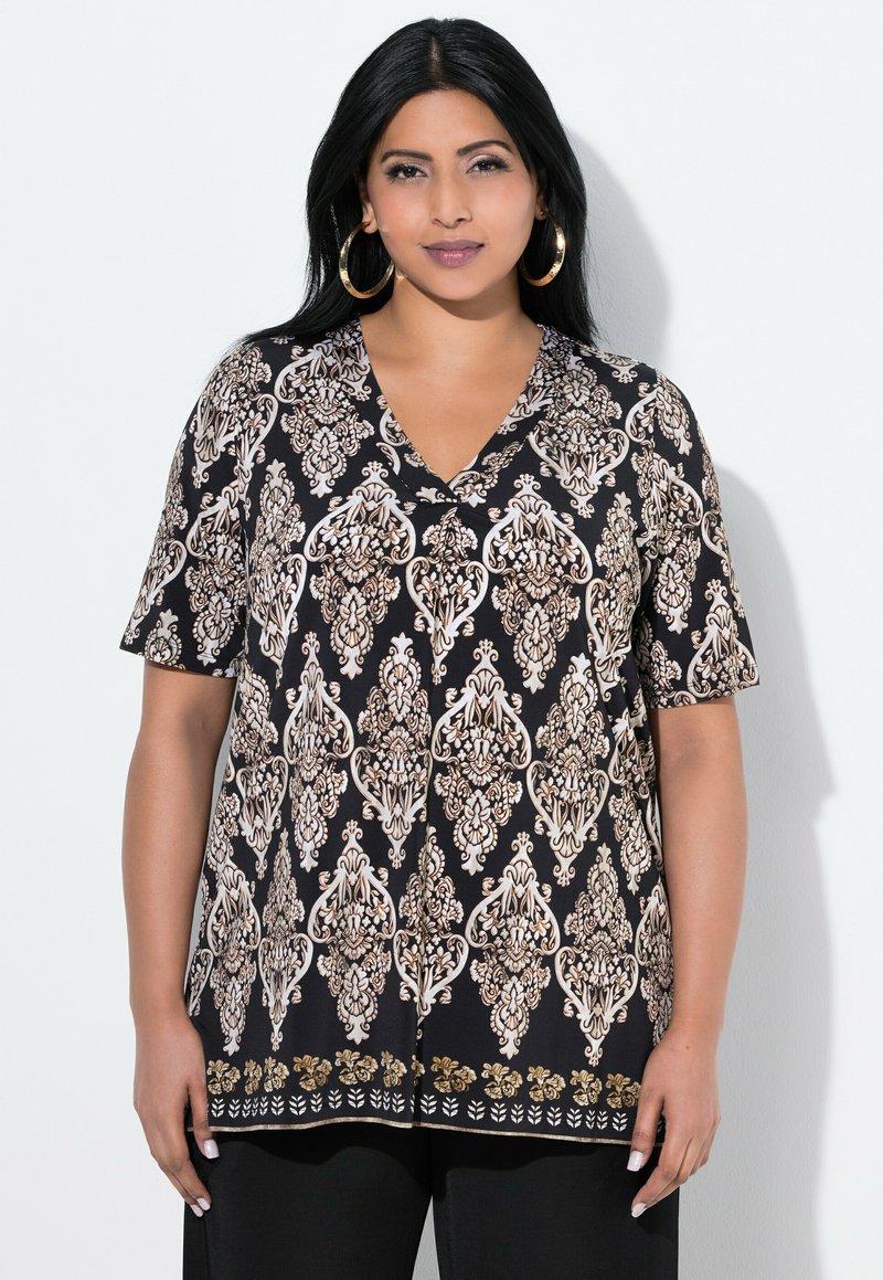 Blusa nera a maniche corte con decorativo motivo paisley in oro e crema, scollo a V e orlo decorativo. Tessuto leggero con vestibilità morbida.