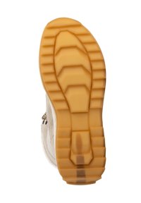 Zool van een beige winterlaars met een dikke, tan rubberen loopvlak dat geometrische patronen toont voor grip.