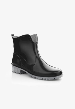 Czarny, lśniący botek na kostkę do deszczu z teksturowanym szarym wnętrzem, solidną gumową podeszwą i szarym bieżnikiem dla lepszej przyczepności.