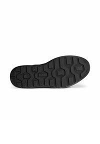 Semelle de chaussure en caoutchouc noir présentant des motifs de traction texturés, des formes hexagonales et un logo, offrant adhérence et durabilité.