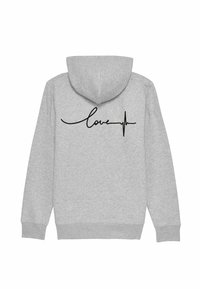 Šedá mikina s kapucí má na zadní straně černý design "láska" a srdeční křivku. Obsahuje stažitelnou kapuci a žebrované manžety. Materiál je měkký a texturovaný.