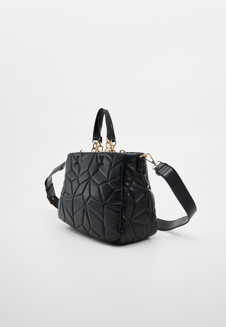 Sac à main en cuir noir matelassé avec une forme structurée, deux poignées supérieures et une bandoulière détachable. Accents en matériel doré visibles.