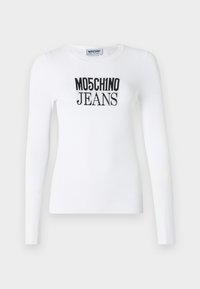Belo rebrasto dolgi rokav s črnim logotipom "MOSCHINO JEANS" natisnjenim čez prsi. Ima okroglo izrez in oprijet kroj.