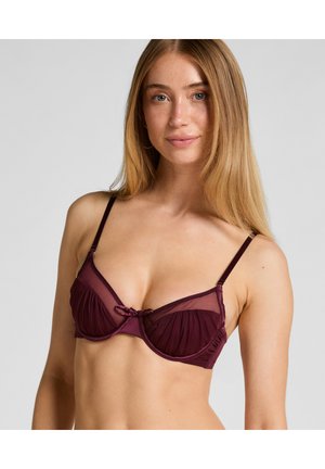 Burgundy underwire bra with sheer mesh cups, ruffled detailing, adjustable straps, and a central bow accent.