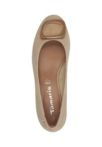 Beige suede flat shoe with a rounded toe, featuring a decorative clear square accent on the upper and a cushioned brown insole.