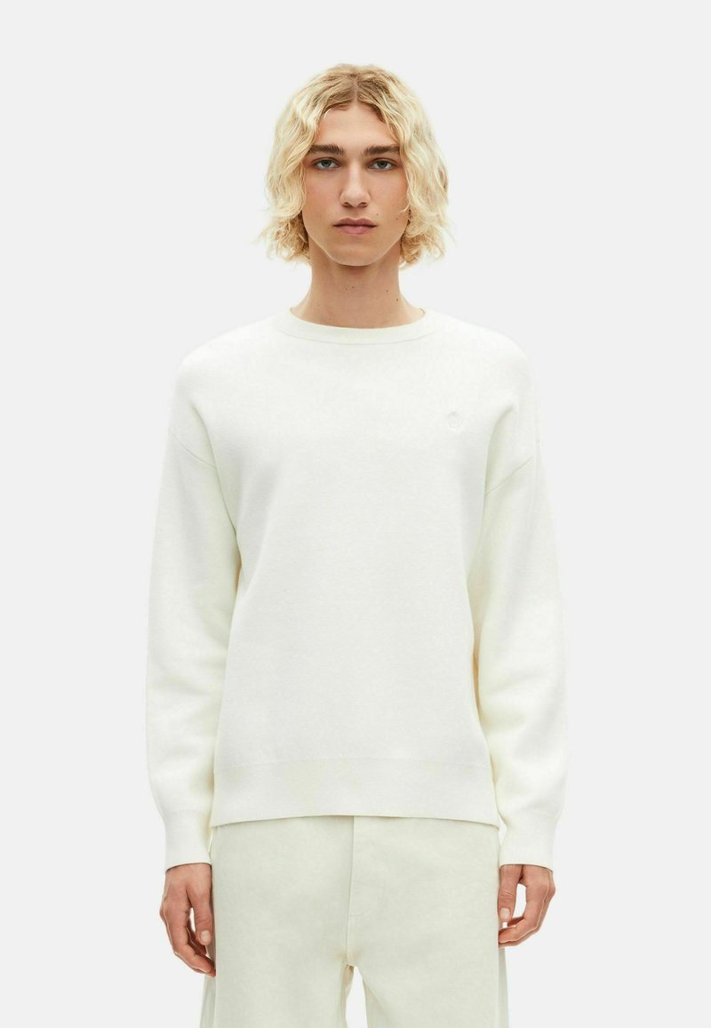 Crewneck sweatshirt i blødt hvidt stof, med en afslappet pasform, ribbede manchetter og kant samt et diskret logo på brystet.