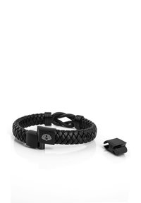 Black braided leather bracelet with a metal clasp featuring a lotus design. Includes an additional matching clasp. Smooth texture.