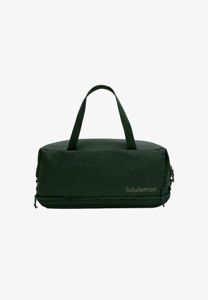 Groene duffelbag met een gladde, gestructureerde buitenkant, voorzien van dubbele handvatten en een ritssluiting. Logo weergegeven op de zijkant.