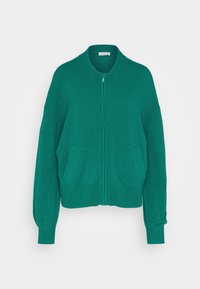 Grön zip-up kofta med ribbad krage och ärmslut. Har två framfickor och ett mjukt, texturerat tyg. Löst passform.