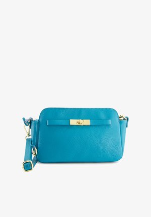 Teal leather crossbody bag with a textured surface, gold-tone hardware, a rectangular shape, and a detachable strap. Accented with a flat tab closure.