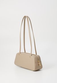 Beige handbag with a rectangular shape, smooth leather material, two long straps, and a gold zipper detail on one side.