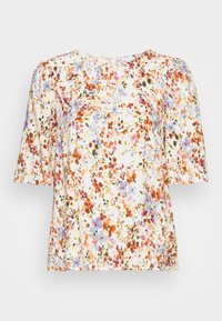 Blus med blommönster, rund halsringning, kort puffärm och vit botten. Har flerfärgade blommor i orange, rosa och blått.