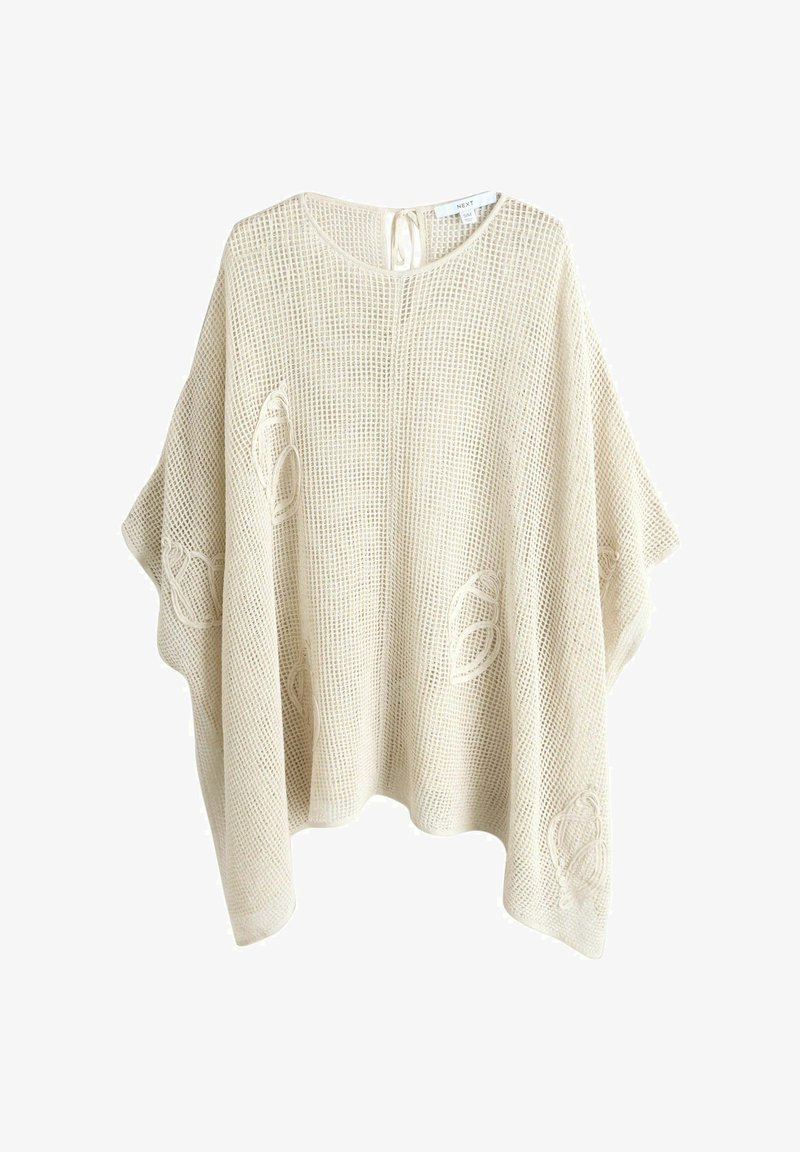 Poncho beige à maille lâche avec manches larges, encolure ronde, fermeture par nœud à l'arrière et motifs discrets de feuilles brodées.