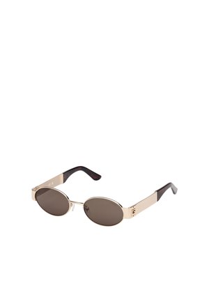Sunglasses with oval brown tinted lenses, gold metal frame, and brown tortoiseshell arms. Features logo accent on the temple.