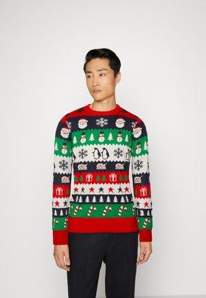 Gebreide kersttrui met een rode kraag en zoom. Heeft patronen van de kerstman, sneeuwvlokken, kerstbomen en pinguïns in groen, rood, marineblauw en wit.