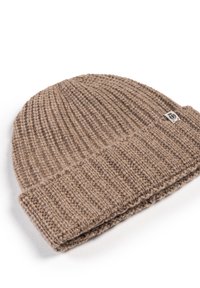 Brown knitted beanie hat with a ribbed texture, folded cuff, and a small tag featuring a logo, made from soft wool material.