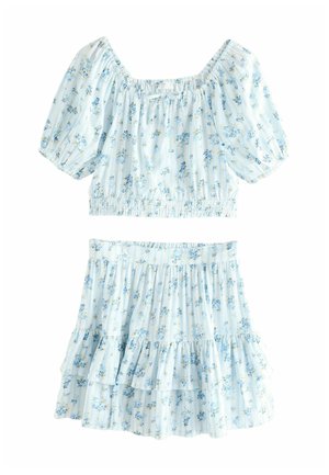 Two-piece outfit featuring a light blue, floral print crop top with puff sleeves and a matching ruffled skirt, both made of soft fabric.