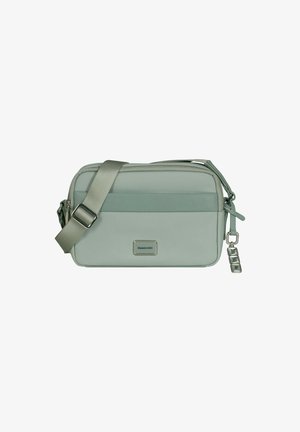 Small rectangular light green crossbody bag with adjustable strap, front zipper pocket, and silver-tone zipper pulls.