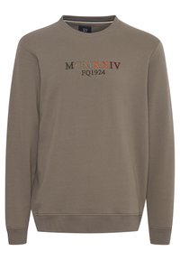 Sudadera de color marrón claro hecha de mezcla de algodón, con cuello redondo y puños acanalados. Texto bordado en hilo multicolor en el pecho.